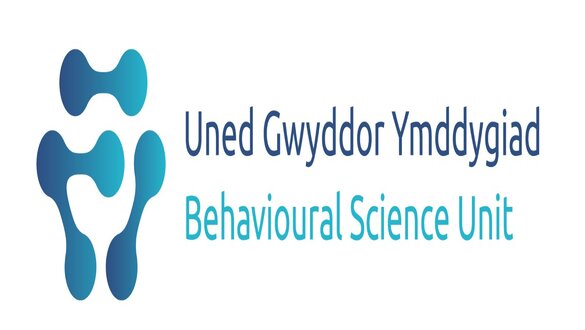 Logo for the Behavioural Science Unit showing abstract blue shapes and the bilingual name 'Uned Ymddygiad / Behavioural Science Unit'.